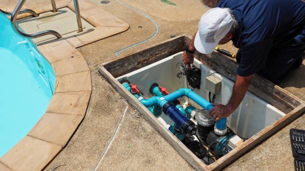 Technician repairing pool equipment to restore circulation and system performance.