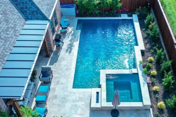 Remodeled backyard pool with updated finishes and modern features in Akron, Ohio.